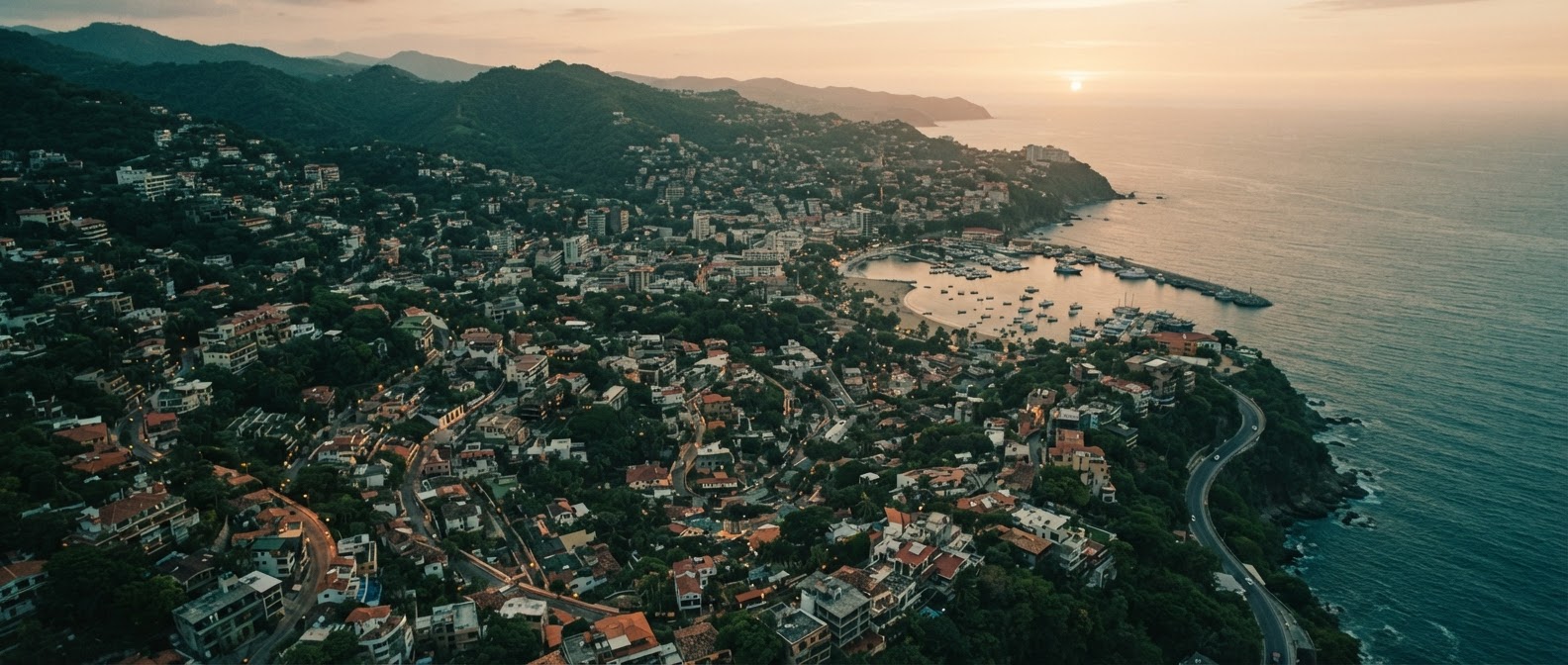 Aerial view of a green coastal town at dusk